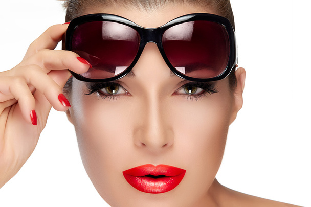 Beautiful Model Holding Fashion Sunglasses on Forehead - Foto, imagen