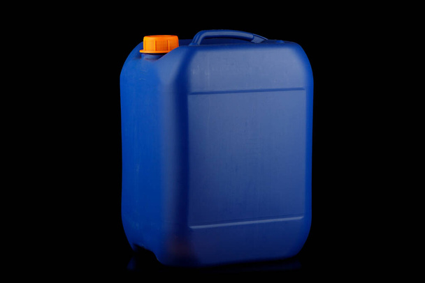 Blue plastic canister black background - Foto, afbeelding
