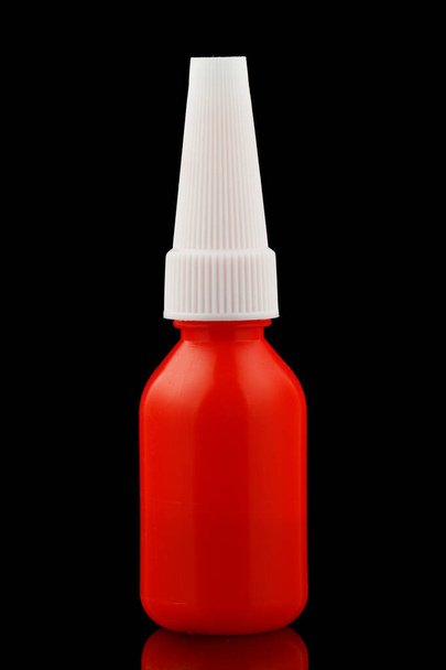 Plastic red jar of glue - Foto, afbeelding