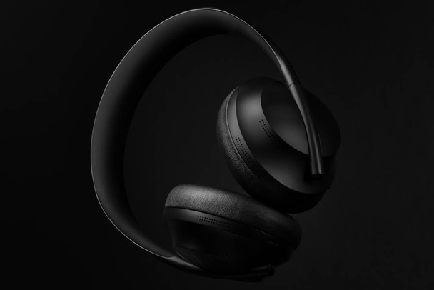 Black set of modern high-end sound headphones, headset for studio or outdoors. - Photo, image