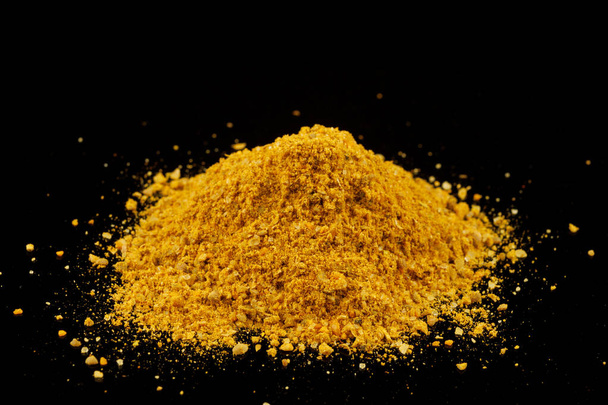 Curry powder seasoning black background - Foto, Bild