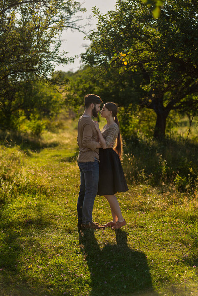 young couple hugging on nature background - Фото, изображение