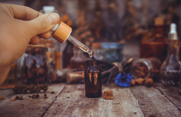 Medicinal herbs and tinctures homeopathy. Selective focus. Nature. - 写真・画像