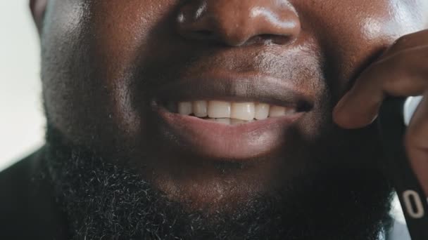 Close up unknown bearded fat man plus size male ethnic face dark skin american businessman reporter talk mobile cell phone interview at office consult client wireless communication distant discussion - Video