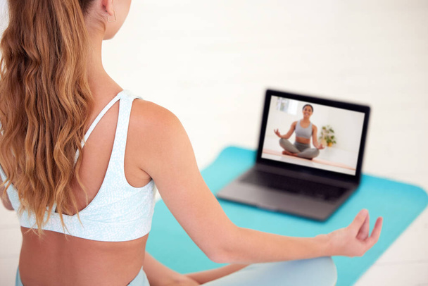 Meditation, video call and yoga woman in online class for chakra energy and stress relief, with spiritual mentor or coach. Young female in wellness with freedom, peace or zen virtual teacher. - Fotó, kép