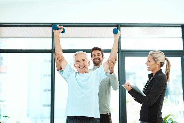 Lets help you move more freely. physiotherapists working with a senior therapist - Valokuva, kuva