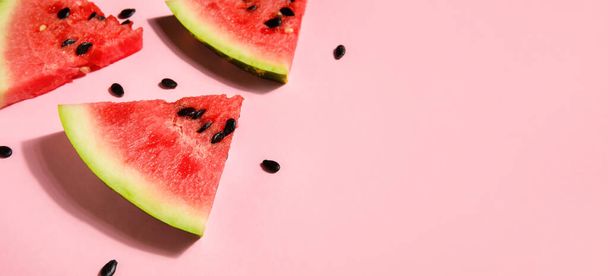 Slices of tasty watermelon on pink background with space for text - Foto, afbeelding