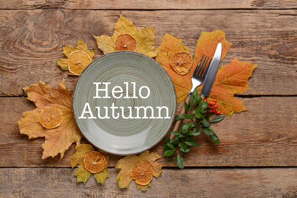 Autumn table setting on wooden background - Foto, afbeelding