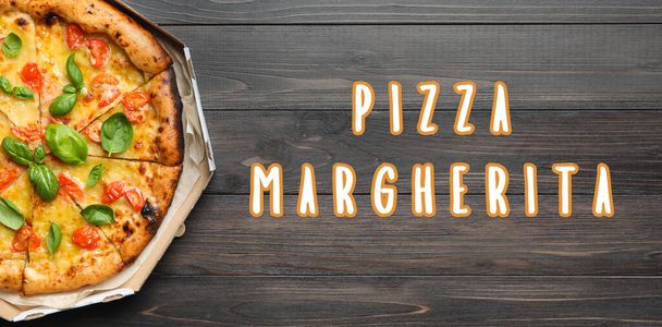 Delicious pizza Margherita on wooden background, top view - 写真・画像