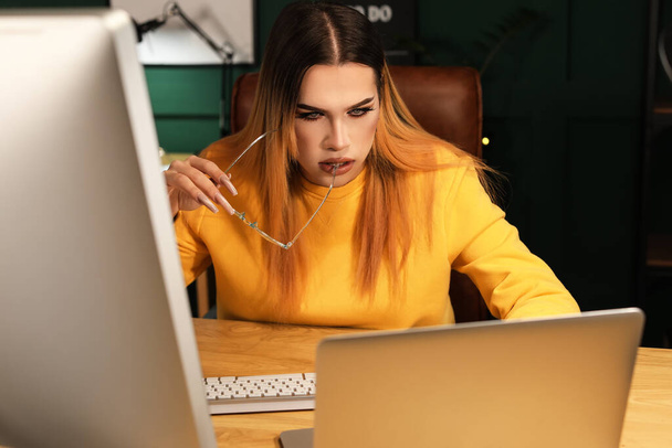 Transgender programmer working in server room - Photo, Image