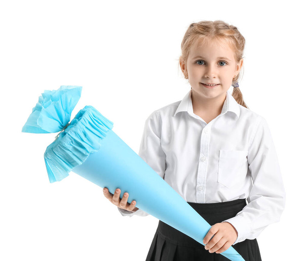 Cute little girl with blue school cone on white background - Фото, зображення