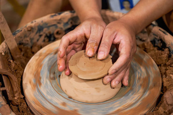 Craftsmen in pottery shop making clay pottery - Foto, imagen