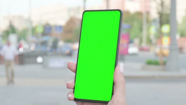 Close Up of Woman Hand Using Smartphone with Green Screen Outdoor - Filmati, video