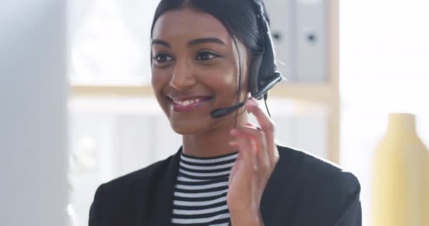 Contact us, telemarketing and support with call center consultant on video call, enjoying job, good customer care. Happy worker smiling and talking to a client, assistance with friendly conversation. - Video