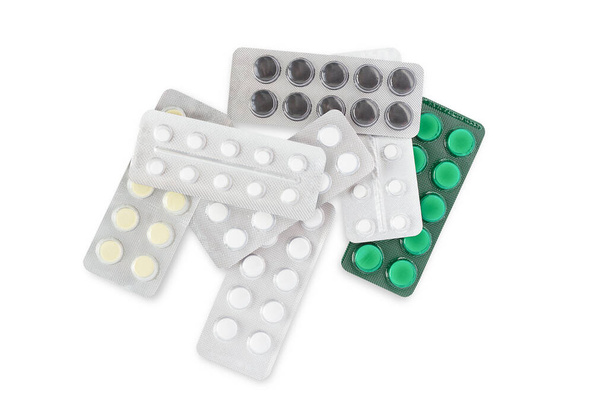 Pile of plates of pills on a white background - Foto, Imagem