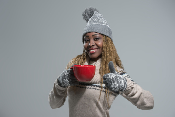 African woman with hot drink - 写真・画像