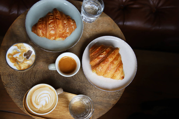 Coffee and croissants in a coffee bar - Foto, Imagem