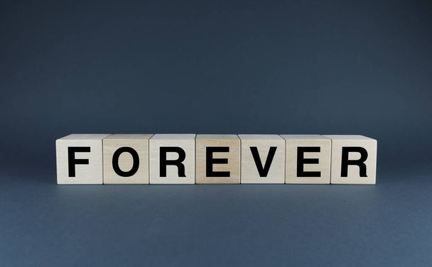 Forever. Cubes form the word Forever. Forever word concept for example love, family, friends - Foto, Imagen