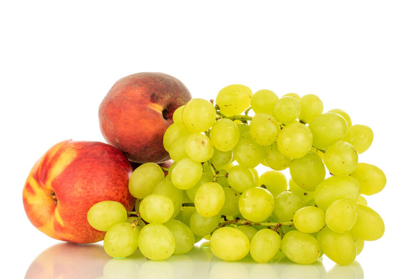 One bunch of white grapes, peach and nectarine, closeup isolated on white background. - Foto, afbeelding