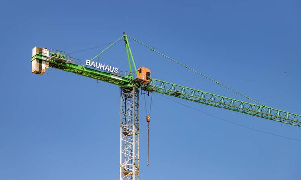 A picture of a Bauhaus crane against a blue sky. - Fotoğraf, Görsel