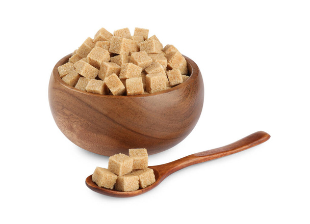 Wooden bowl and spoon with brown sugar cubes on white background - Valokuva, kuva