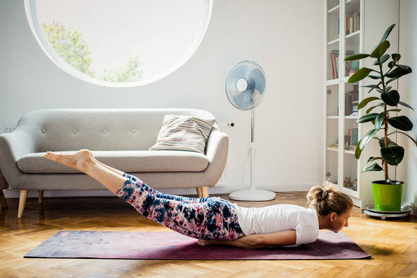 woman doing yoga at home healthy lifestyle - Photo, image