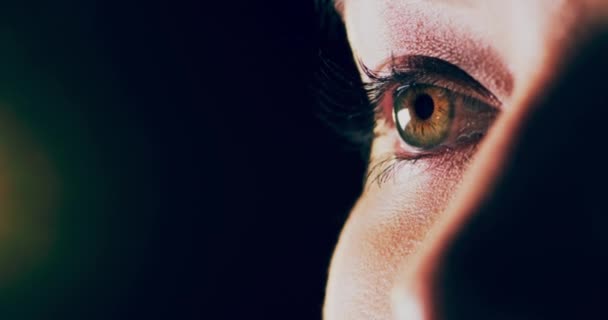 Eyes, vision and color with a woman thinking of an idea in studio on black background. Eyesight and optometry test for prescription glasses or contact lenses with blank space for mockup. - Footage, Video