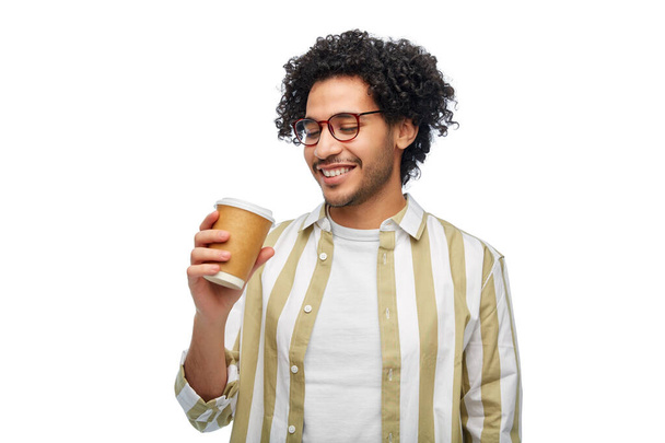drinks and people concept - smiling young man in glasses with takeaway coffee cup over white background - Foto, immagini