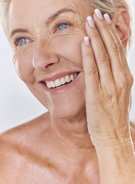 Skincare, wellness and beauty face of happy mature woman grooming, apply facial or hygiene treatment. Senior female enjoying anti aging cosmetics on wrinkles, self care and routine cleaning at home. - Foto, immagini
