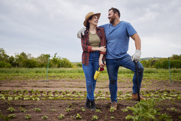 Startup, success and agriculture, couple work farm together. Sustainability, teamwork and small business of sustainable food production. Happy farmer, man and woman work in growth, love and farming - 写真・画像