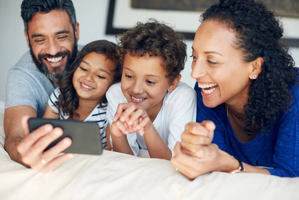 Lets see those big smiles. a happy family taking a selfie together at home - Photo, image