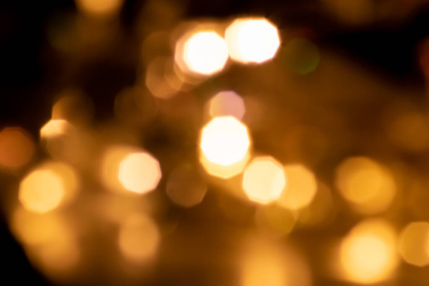 Shiny Christmas lights bokeh background with sparkling bokeh as blurry background for celebration party disco glitter or Christmas eve and a happy new year atmosphere with shining lights and circles - Foto, Imagen