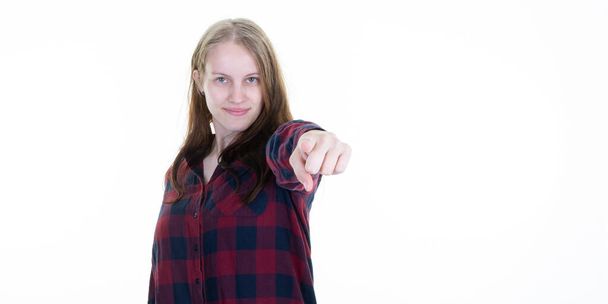 cheerful young caucasian woman smiling face pointing hand at camera with index fingers - Foto, afbeelding