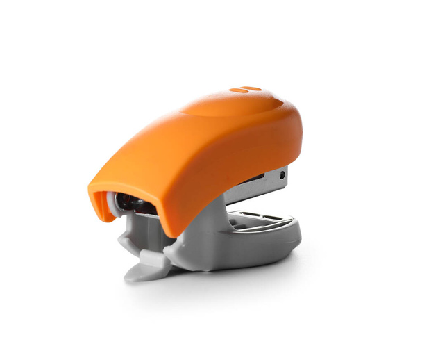 Modern orange stapler on white background - Valokuva, kuva