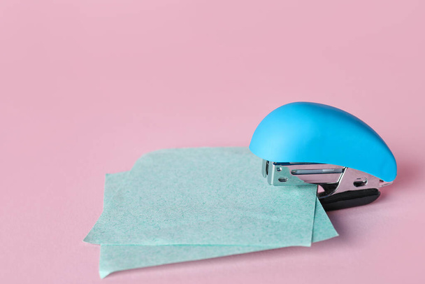 Stapler with sticky notes on pink background - Photo, Image