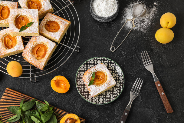 Composition with tasty apricot pie on dark background - Foto, immagini