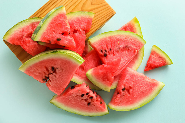 Slices of watermelon on blue background - Fotoğraf, Görsel