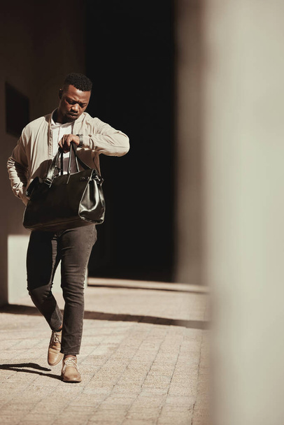 A watch, time and a business man late to a deal or meeting with a bag in the city. Busy black male worker, walking or travel or journey or rushing to a bus or plane for corporate business trip. - Foto, Imagem