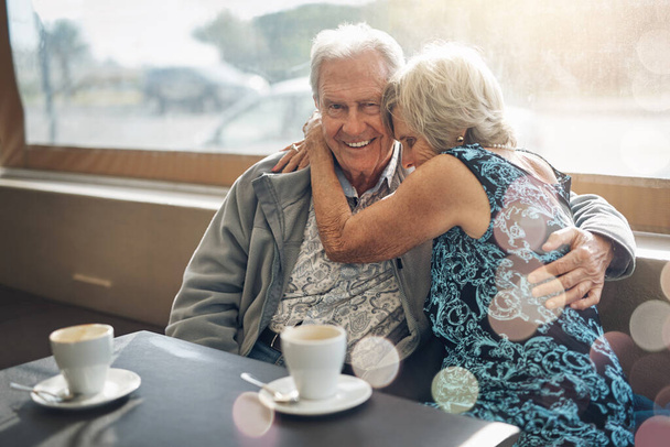 Keeping the romance alive with a good old coffee date. a mature couple spending the day together - Foto, Imagen