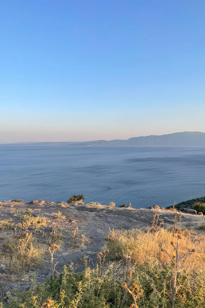 Assos,Turkey.August 12,2022.Summer vacation and Aegean sea view from Assos, located across the island of Lesbos - Foto, imagen