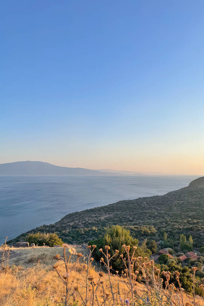 Assos,Turkey.August 12,2022.Summer vacation and Aegean sea view from Assos, located across the island of Lesbos - Foto, imagen