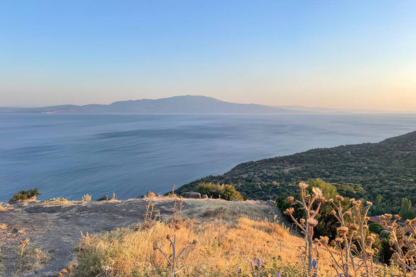 Assos,Turkey.August 12,2022.Summer vacation and Aegean sea view from Assos, located across the island of Lesbos - Photo, Image