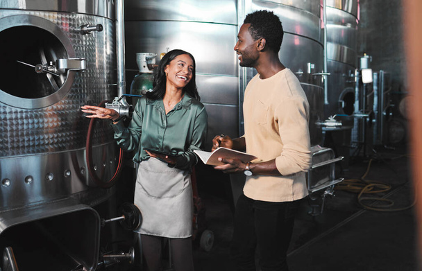 Wine business manufacturing warehouse factory, winery tank cellar brewery warehouse. Happy female winemaker employee at work b2b, ferment grape fruit storage.process and partner company meeting job. - Foto, Imagem