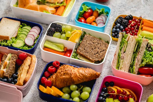 Various of Healthy lunch boxes. Pack for school set in plastic package. Top view flat lay. - Photo, Image