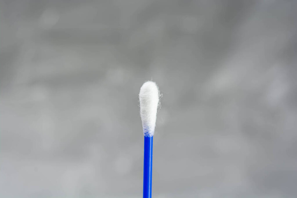Cotton swab on white background with room for text - Foto, imagen