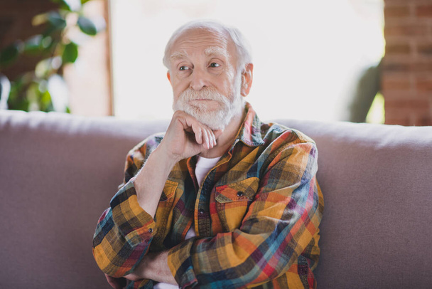 Close up photo of handsome granddad white hair minded conversation psychotherapy dressed casual plaid look sit couch indoors home flat room. - Foto, Imagem