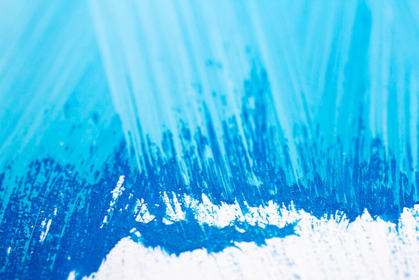 Extreme close up of blue acrylic paint texture showing brush strokes. Selective focus. - Fotó, kép