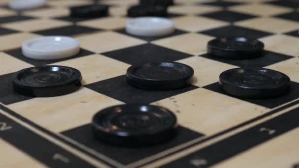 Close up of hand-moving checker pieces. - Filmagem, Vídeo