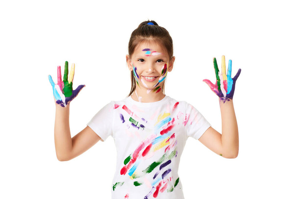 happy little child girl with hands painted in colorful paint isolated on white background. - Foto, Imagem