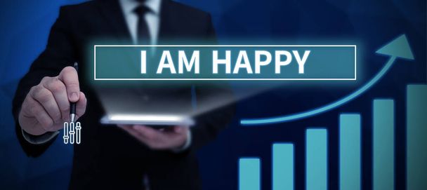 Podpis konceptualny I Am Happy, Concept meaning To have a fulfilled life full of love good job happiness Mężczyzna wytykający palcami trzymający trofeum doping osiągający sukces projektu. - Zdjęcie, obraz
